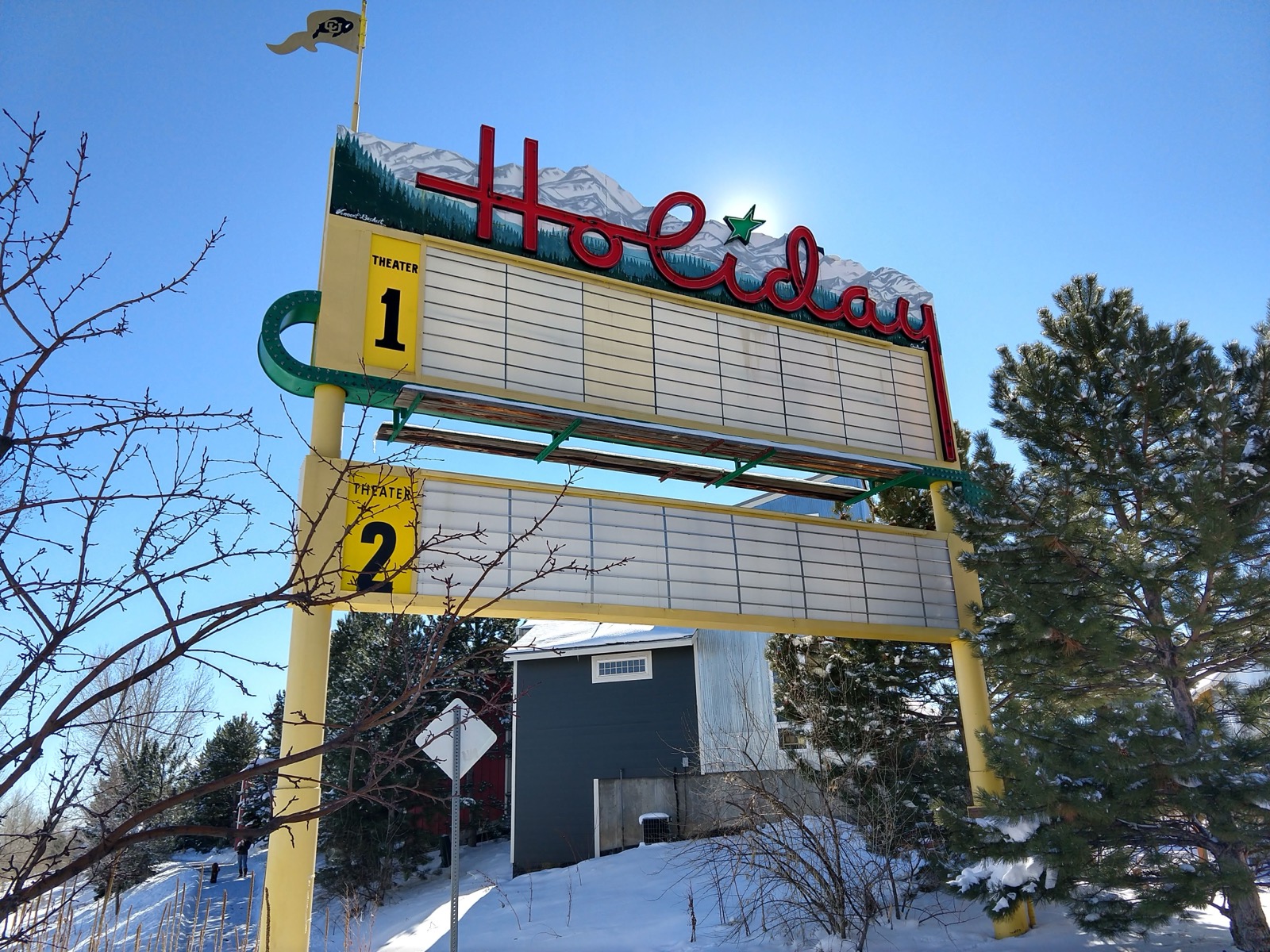 The restored Holiday Twin Drive-In sign on North Broadway in winter